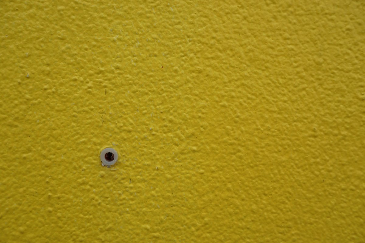 Yellow-wall-with-holes